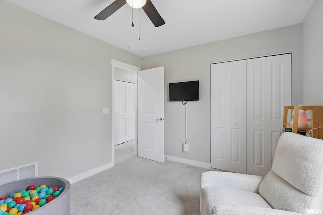 4625 W 11th St, Davenport, IA 52804 - living area featuring light colored carpet, baseboards, and ceiling fan