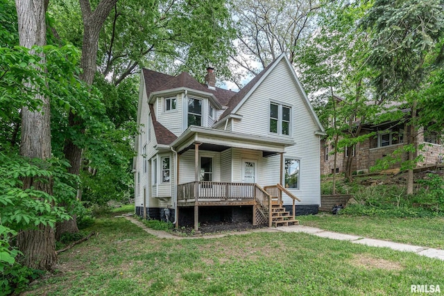 534 Lincoln Ct, Davenport, IA 52804 - view of front of property with a porch, a chimney, a front yard, and a shingled roof