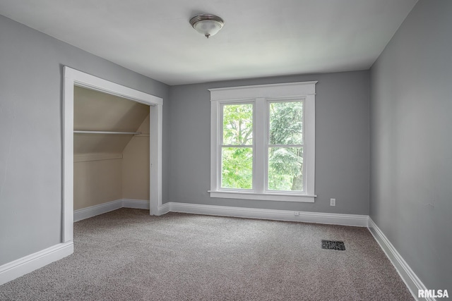534 Lincoln Ct, Davenport, IA 52804 - unfurnished bedroom featuring carpet, a closet, and baseboards