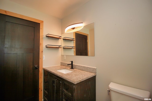 half bath with toilet and vanity