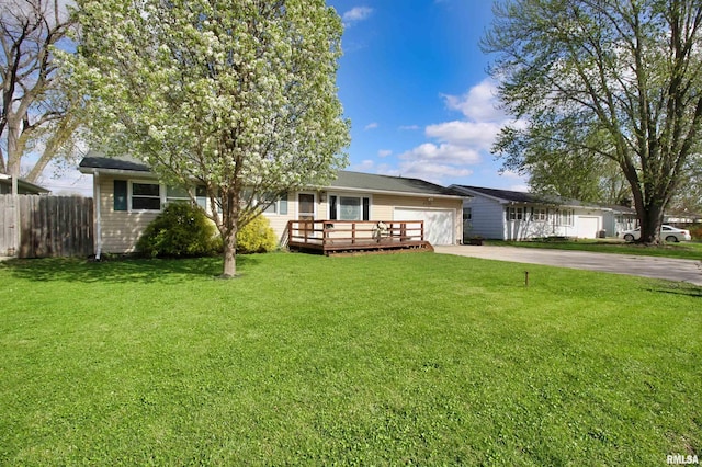 single story home with concrete driveway, an attached garage, and a wooden deck