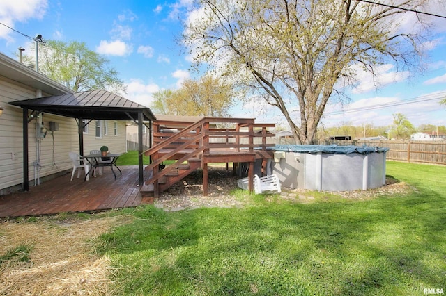 view of yard featuring a wooden deck, a gazebo, and stairs