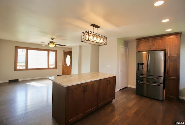 kitchen featuring stainless steel fridge, recessed lighting, dark wood-style floors, baseboards, and light stone counters