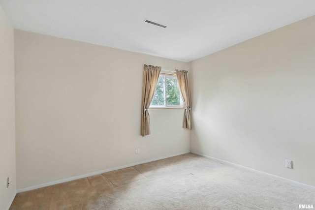 empty room with baseboards and carpet floors