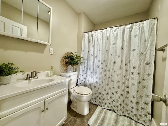 1207 Tremont Ave, Davenport, IA 52803 - full bathroom with toilet, vanity, tile patterned flooring, and a shower with shower curtain