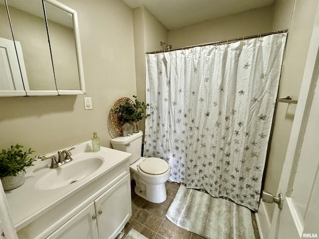 1207 Tremont Ave, Davenport, IA 52803 - bathroom featuring toilet, vanity, a shower with curtain, and tile patterned floors