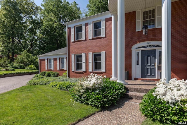 1220 38th Avenue Ct, Rock Island, IL 61201 - greek revival inspired property featuring brick siding and a front yard