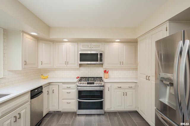 1220 38th Avenue Ct, Rock Island, IL 61201 - kitchen with stainless steel appliances, light countertops, backsplash, and recessed lighting