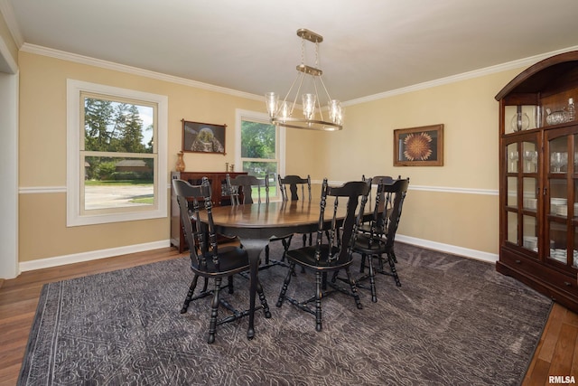1220 38th Avenue Ct, Rock Island, IL 61201 - dining area featuring a chandelier, wood finished floors, crown molding, and baseboards