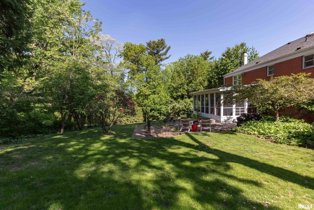 1220 38th Avenue Ct, Rock Island, IL 61201 - view of green lawn featuring a sunroom