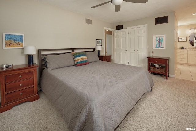 1220 38th Avenue Ct, Rock Island, IL 61201 - bedroom featuring light carpet, a closet, a ceiling fan, and ensuite bath