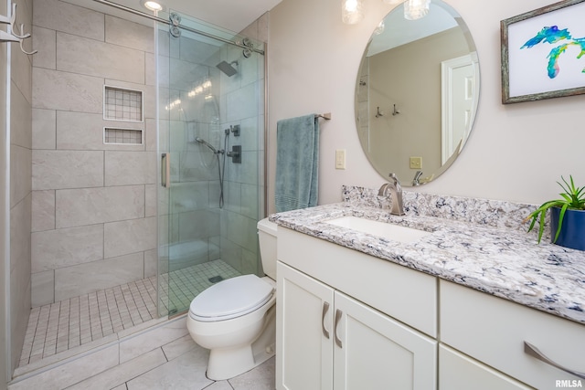 1220 38th Avenue Ct, Rock Island, IL 61201 - bathroom featuring toilet, a shower stall, vanity, and tile patterned flooring