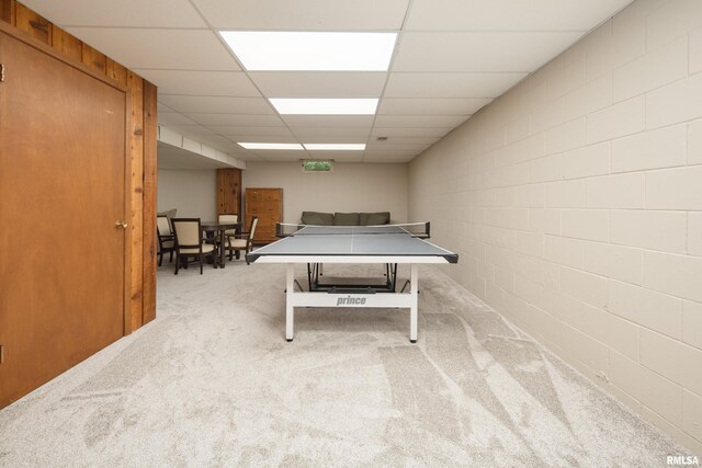1220 38th Avenue Ct, Rock Island, IL 61201 - rec room with carpet flooring, a paneled ceiling, and concrete block wall