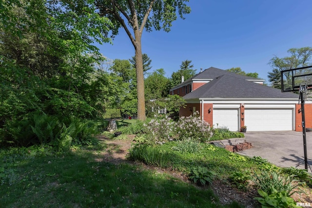 1220 38th Avenue Ct, Rock Island, IL 61201 - view of yard with a garage and concrete driveway