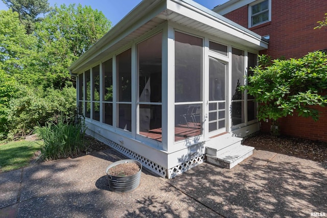 1220 38th Avenue Ct, Rock Island, IL 61201 - view of property exterior with a sunroom and entry steps