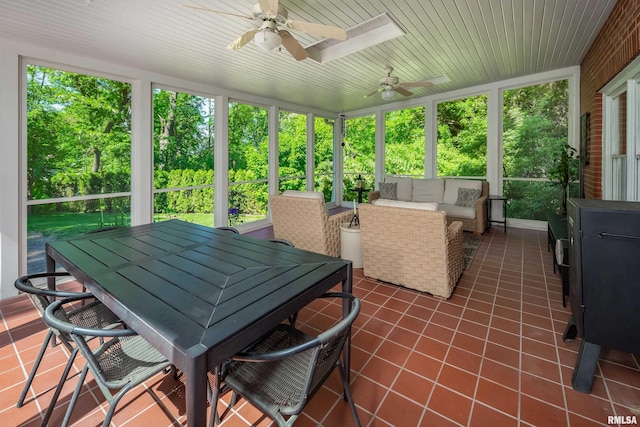 1220 38th Avenue Ct, Rock Island, IL 61201 - sunroom / solarium with a ceiling fan, outdoor dining space, and an outdoor living space