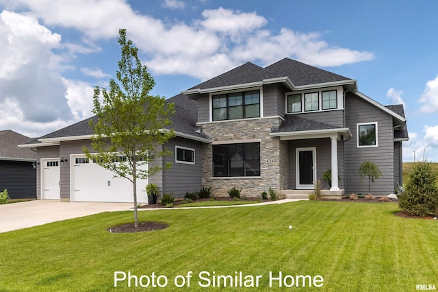6501 Blackbird Ln, Bettendorf, IA 52722 - prairie-style house with driveway, a garage, stone siding, and a front lawn