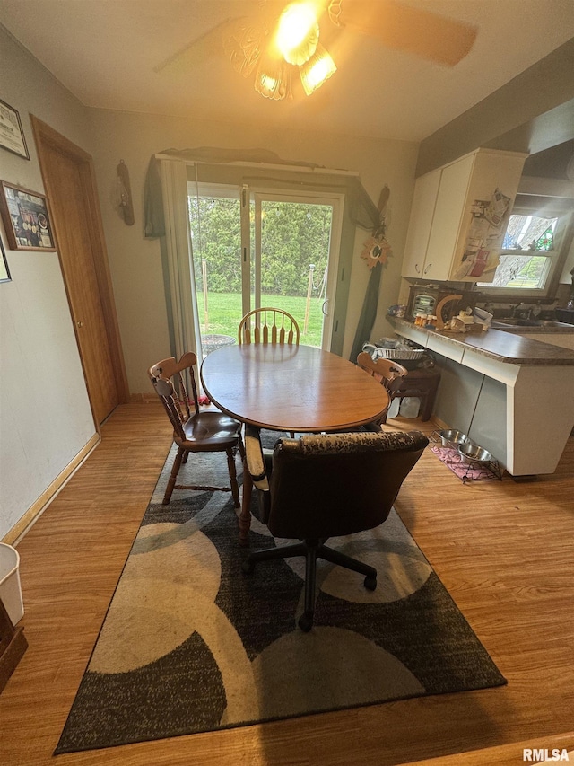 dining space with light wood-type flooring