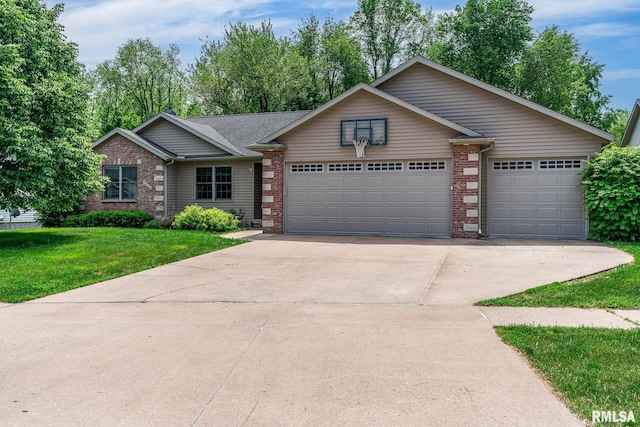 1004 Wild W Dr, Le Claire, IA 52753 - ranch-style house featuring brick siding, a garage, driveway, and a front yard