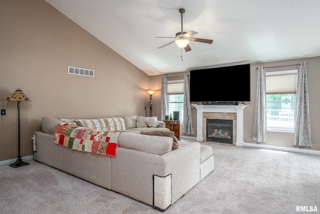 1004 Wild W Dr, Le Claire, IA 52753 - living room with a ceiling fan, carpet floors, a fireplace, plenty of natural light, and vaulted ceiling