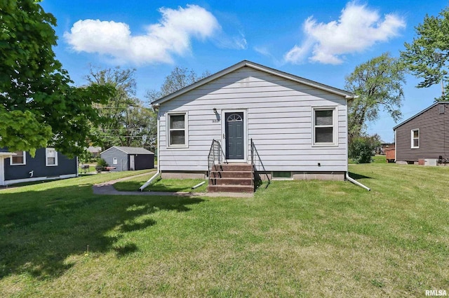 930 Ten Plus St, Bettendorf, IA 52722 - rear view of property featuring entry steps and a lawn