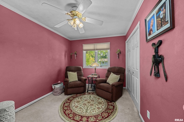 2512 W 45th St, Davenport, IA 52806 - sitting room featuring carpet floors, crown molding, a ceiling fan, and baseboards