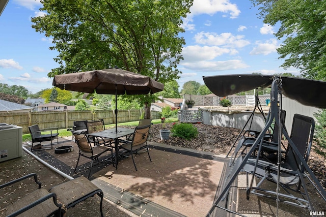 2512 W 45th St, Davenport, IA 52806 - view of patio with a fenced backyard and outdoor dining area