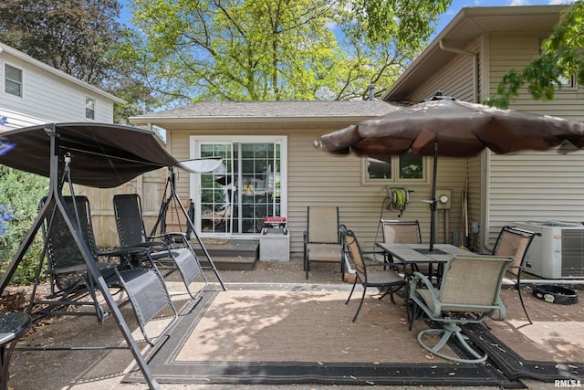 2512 W 45th St, Davenport, IA 52806 - view of patio / terrace featuring central AC and outdoor dining area