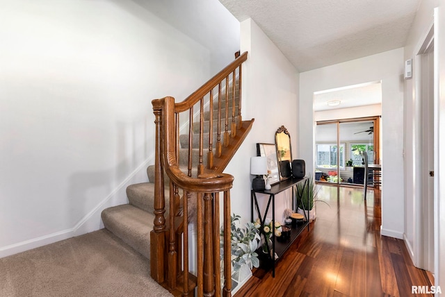 2115 W 31st St, Davenport, IA 52804 - staircase featuring wood finished floors and baseboards