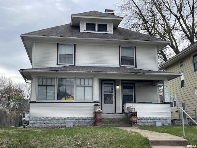 1201 W 17th St, Davenport, IA 52804 - american foursquare style home featuring a porch, roof with shingles, and fence
