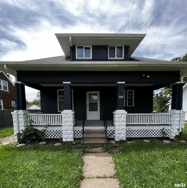 243 44th St, Moline, IL 61265 - view of front of home with covered porch and a front yard