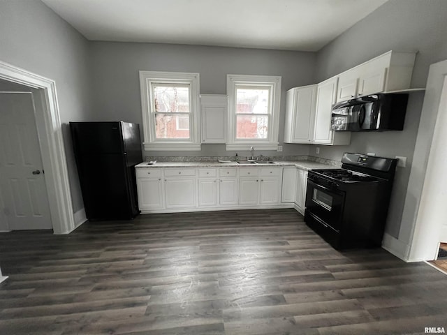 724 W 8th St, Davenport, IA 52804 - kitchen with black appliances, a sink, white cabinets, dark wood-style floors, and baseboards