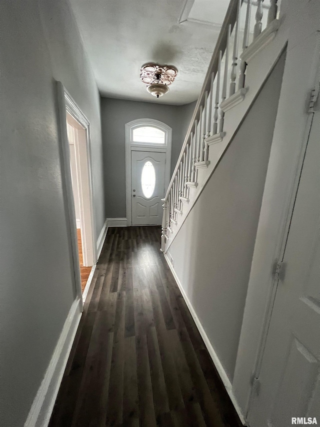 724 W 8th St, Davenport, IA 52804 - doorway featuring dark wood-style flooring, baseboards, and stairway