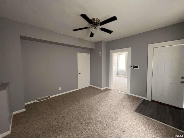 1627 W 4th St, Davenport, IA 52802 - carpeted spare room featuring ceiling fan and baseboards