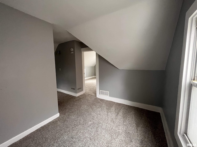 1627 W 4th St, Davenport, IA 52802 - bonus room with lofted ceiling, carpet flooring, and baseboards