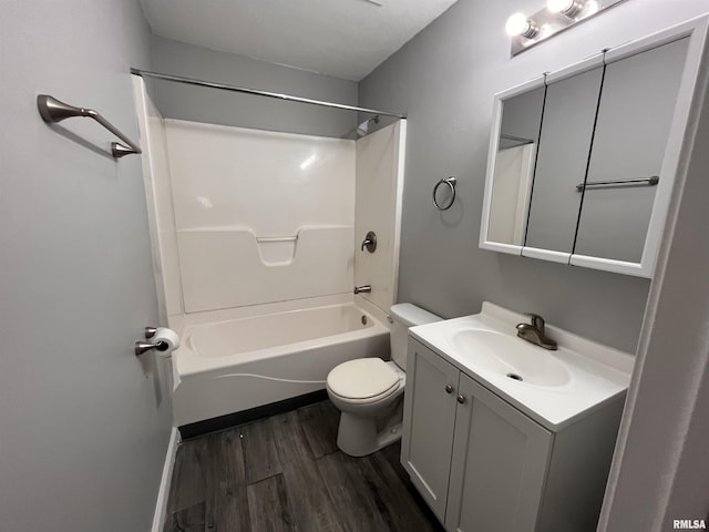 1627 W 4th St, Davenport, IA 52802 - full bath featuring wood finished floors, toilet, vanity, and bathing tub / shower combination