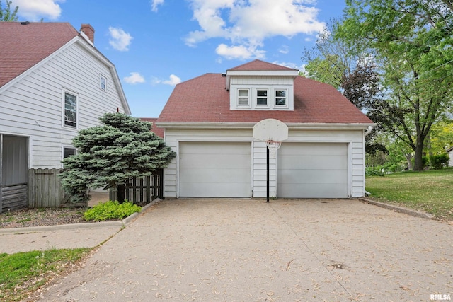 garage with fence