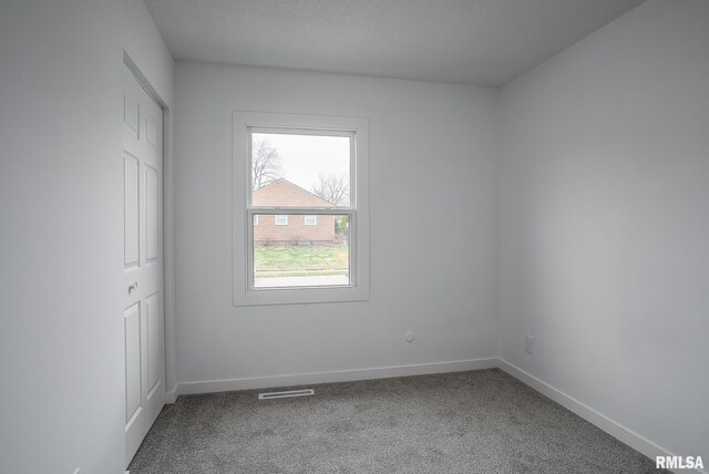 1729 Welshire Dr, Davenport, IA 52806 - unfurnished bedroom featuring carpet floors, baseboards, and a closet