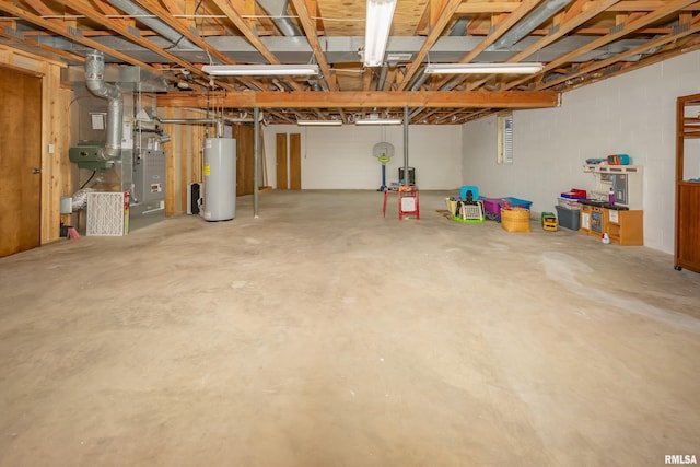 unfinished below grade area featuring water heater and heating unit