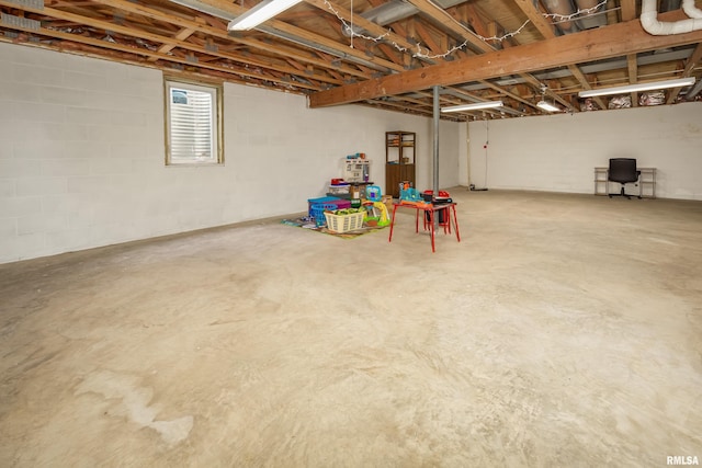 basement featuring concrete block wall