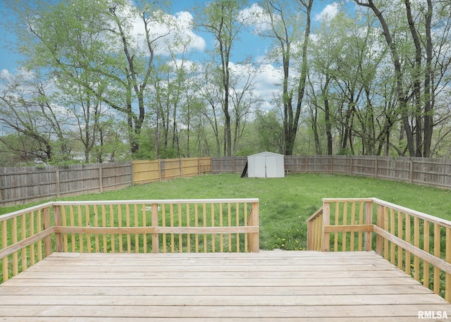 wooden deck with a shed and an outbuilding