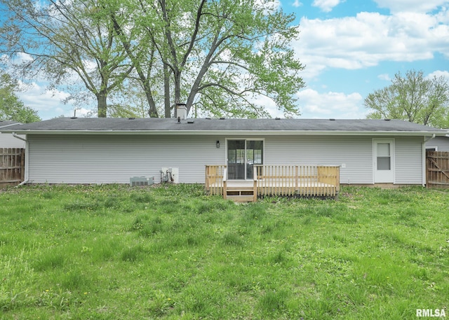 rear view of house featuring a deck and central AC