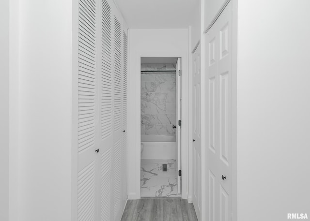 hallway with marble look tiles