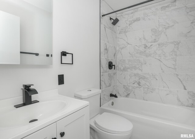 bathroom featuring toilet, shower / tub combination, and vanity