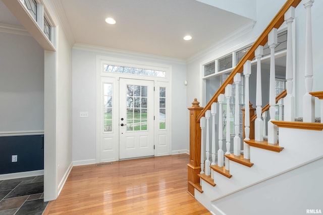 6800 Ridges Ct, Bettendorf, IA 52722 - entryway featuring ornamental molding, baseboards, plenty of natural light, recessed lighting, and stairway