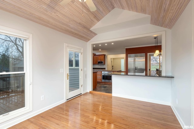 6800 Ridges Ct, Bettendorf, IA 52722 - kitchen with stainless steel appliances, dark countertops, healthy amount of natural light, lofted ceiling, and ceiling fan