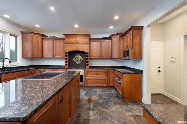 6800 Ridges Ct, Bettendorf, IA 52722 - kitchen with stainless steel appliances, a sink, brown cabinets, crown molding, and dark stone finish flooring