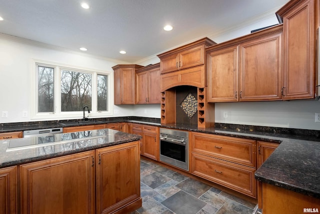 6800 Ridges Ct, Bettendorf, IA 52722 - kitchen with oven, a sink, ornamental molding, dark stone countertops, and recessed lighting