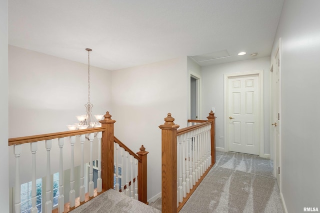 6800 Ridges Ct, Bettendorf, IA 52722 - corridor with an upstairs landing, carpet floors, a chandelier, recessed lighting, and baseboards