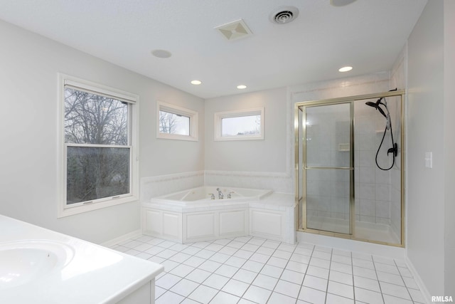 6800 Ridges Ct, Bettendorf, IA 52722 - full bath with tile patterned flooring, a sink, a shower stall, and recessed lighting